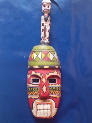 Wooden mask used, ethnic style with carved human figure, 55x16 cm