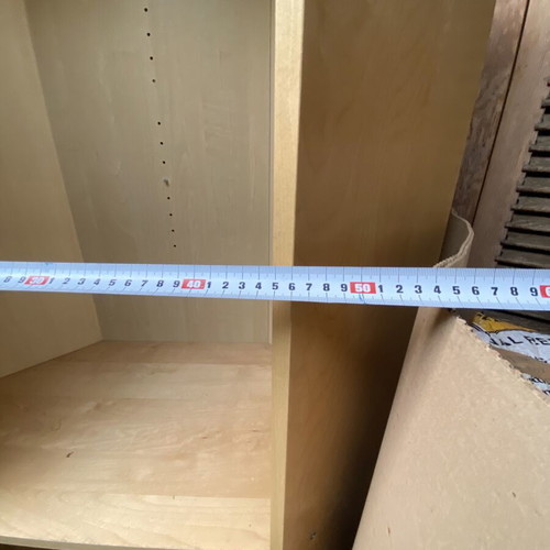 Polygonal beech-colored bookcase used, adjustable shelves