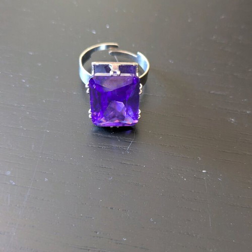 Steel ring like new with purple synthetic stone