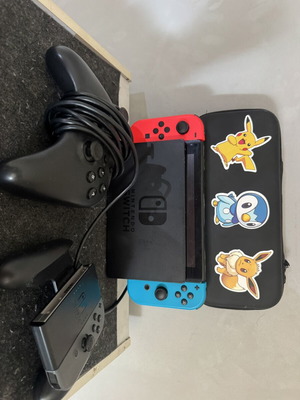 Nintendo Switch V2 console used with accessories and scratched screen