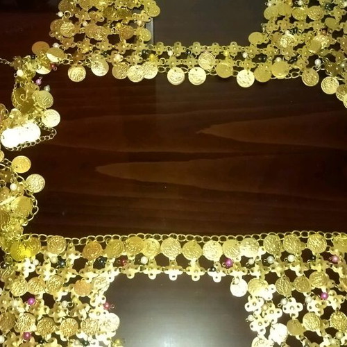 Genuine Khanoumisa belt like new, adjustable, gold-colored
