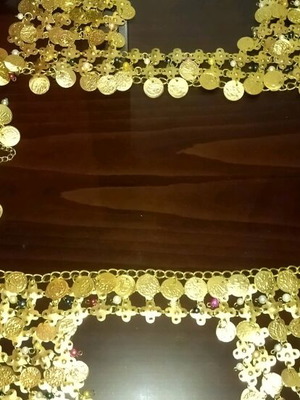 Genuine Khanoumisa belt like new, adjustable, gold-colored