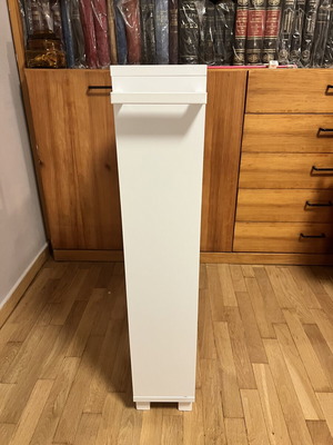 White kitchen shelf unit with adjustable shelf and wheels