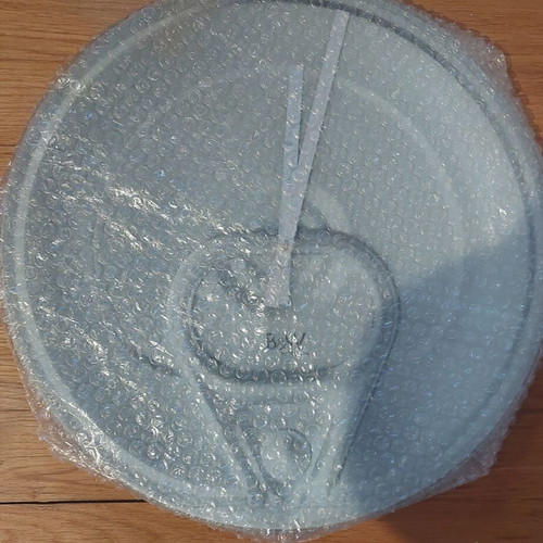 Glass wall clock like new with soda can lid design