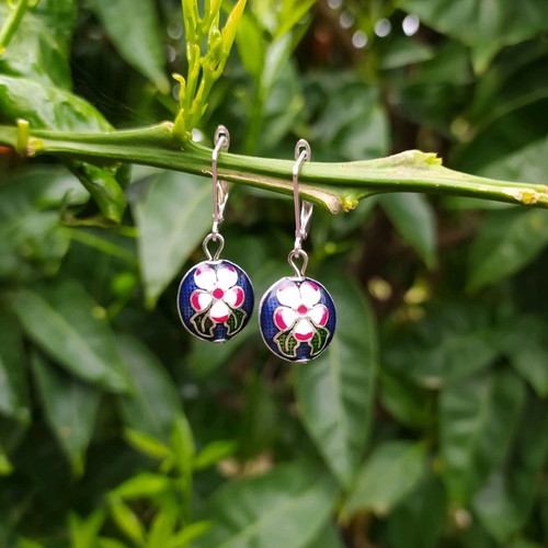 Handmade earrings used with metal elements and enamel