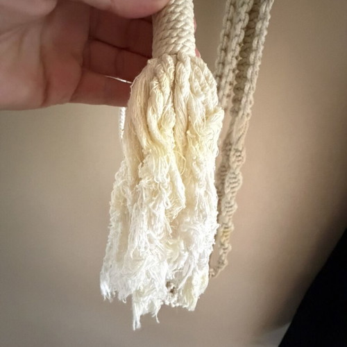 Macrame plant hanger used with wooden beads for pots