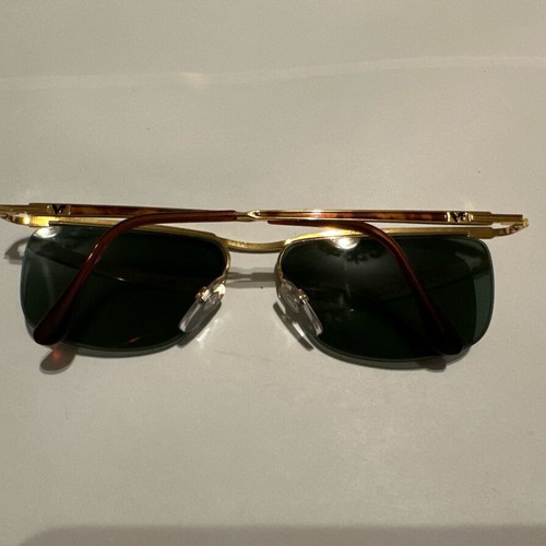 Vintage Vogue sunglasses with gold metal frame and green lenses