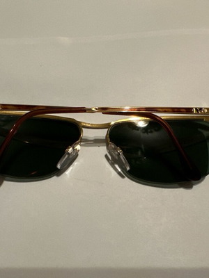 Vintage Vogue sunglasses with gold metal frame and green lenses