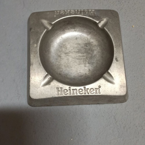 Metal ashtray used from branded company Heineken