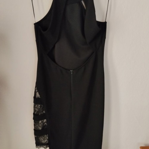 Black mini dress like new with open back and lace slit