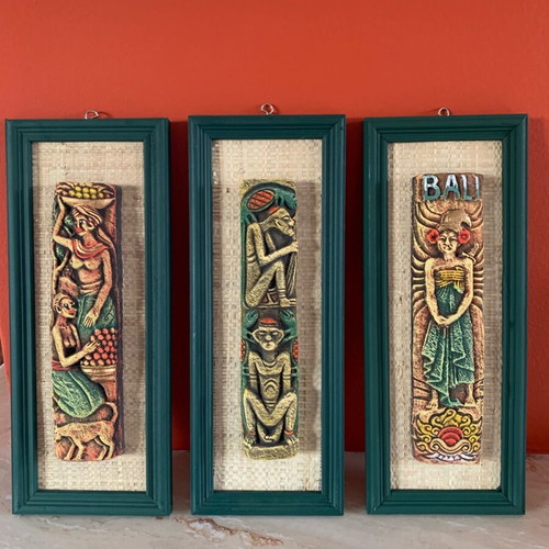 Handmade wooden frames with embossed exotic figures from Bali