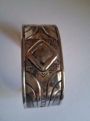 Cuff bracelet like new, silver tone with ethnic tribal design