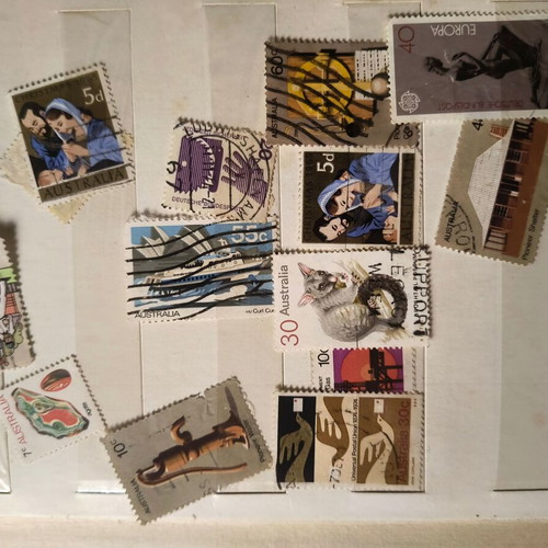Stamp album like new with about 500 mostly foreign stamps