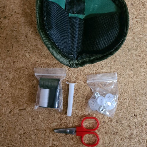 Small sewing kit new with needles, threads, buttons and scissors