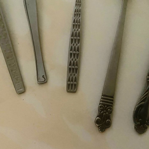 Vintage cutlery set used, 9 pieces with decorative designs