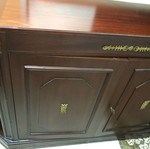 Solid walnut corner cabinet with brass details