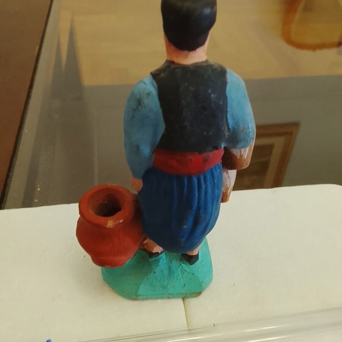 Traditional handmade clay figurine of a villager used
