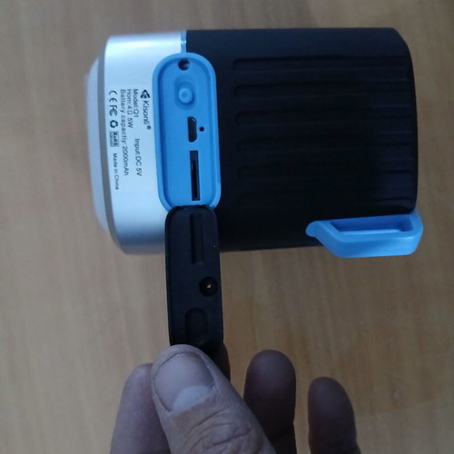Speaker with rechargeable flashlight used with microSD slot