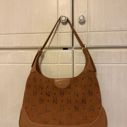 Nolah shoulder bag in camel and brown with monogram design