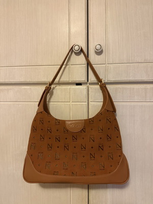 Nolah shoulder bag in camel and brown with monogram design