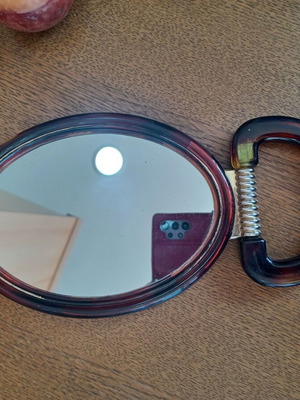 Hand mirror used, dimensions 17.5x13 cm, does not stand