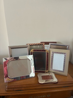 Set of photo frames in various sizes like new, small silver one