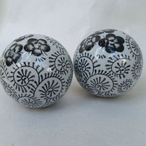 Vintage decorative porcelain spheres set like new with floral and geometric designs