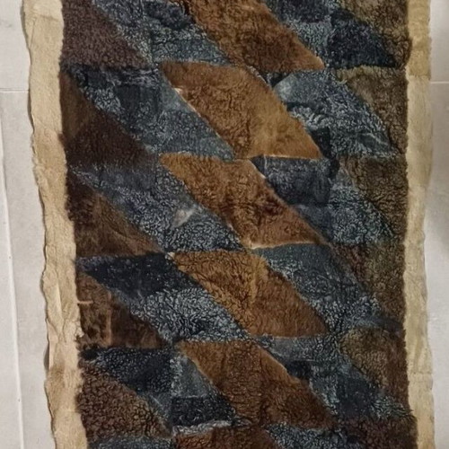 Handmade fur patchwork rug used in earthy tones