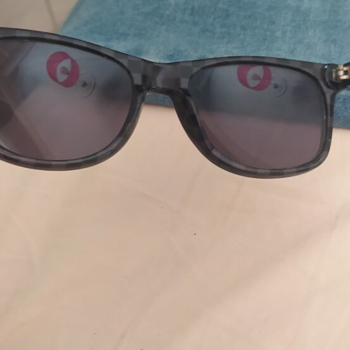 Vans sunglasses used with scratched lenses and slightly loose arms