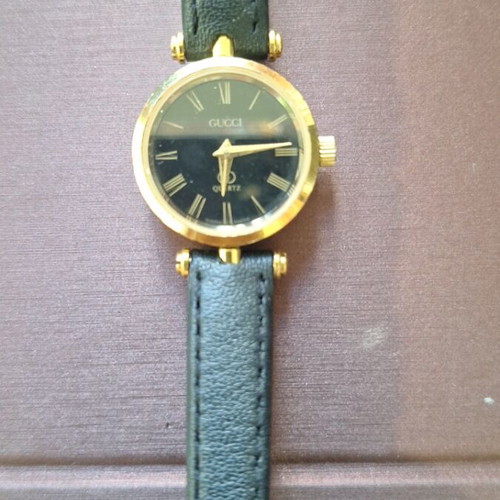 Gucci women's wristwatch vintage, like new, black and gold