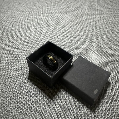 Ring with gold Celtic design on black base new
