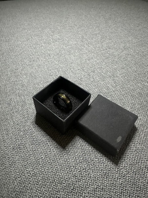 Ring with gold Celtic design on black base new