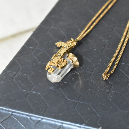 Swarovski necklace with saxophone pendant and crystal like new, gold plated