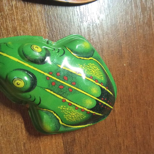 Tin toy replicas used, decorative frog figures