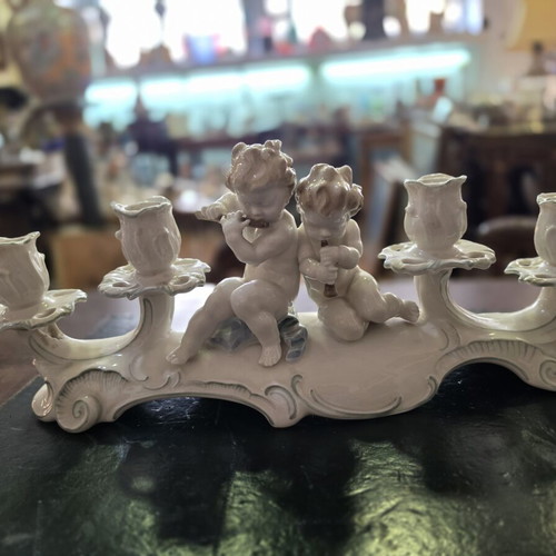 Hutschenreuther Selb porcelain four-light candelabra used, putti design