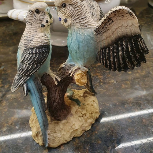 Figurine of two beautiful parrots on a branch like new
