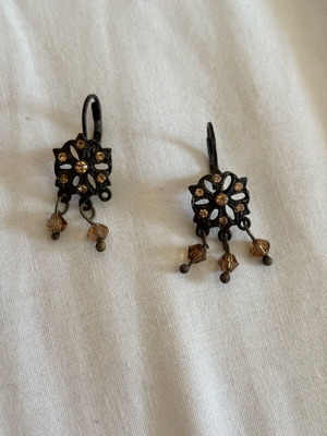 Dangling earrings used, missing one pendant