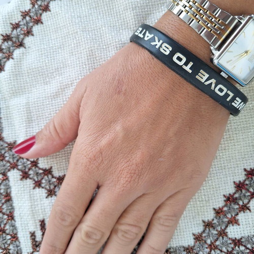 Black elastic rubber bracelet with letters used