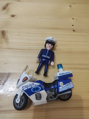 Playmobil police figure with motorcycle like new