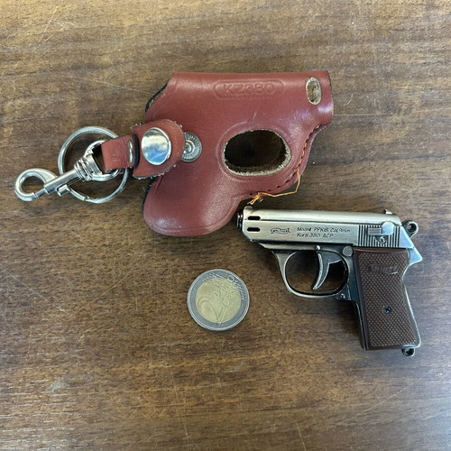 Gun-shaped lighter with case