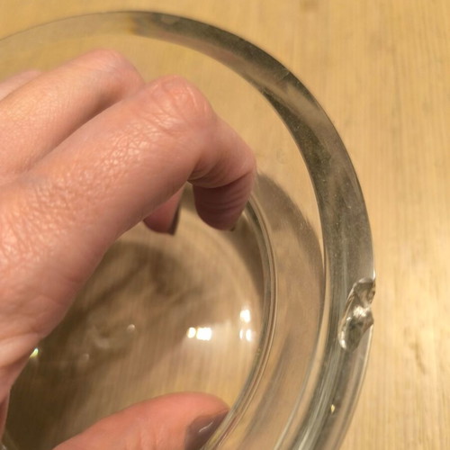 Glass decorative bowl used with silver flower design