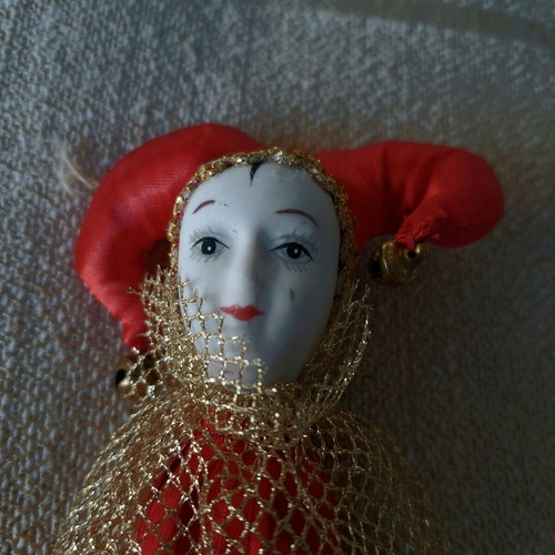 Decorative Harlequin figure on stick like new, red costume