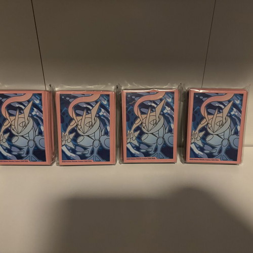 Pokemon card sleeves, 11 packs from different sets