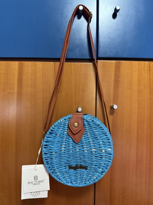 Bag to Bag round turquoise crossbody bag with woven texture
