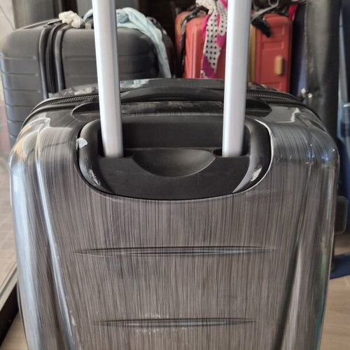 Samsonite hard suitcase used with TSA lock and 4 wheels