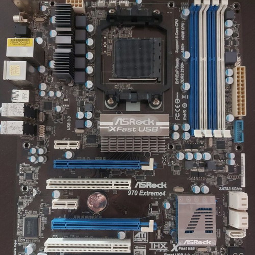 AsRock 970 Extreme4 AM3+ motherboard used, functional with updated BIOS