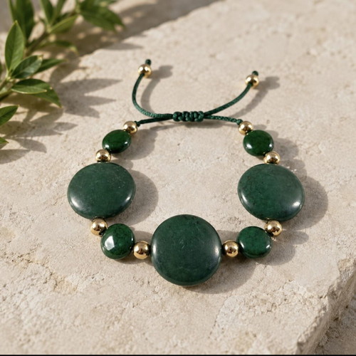 Bracelet with green stones and gold details, adjustable cord