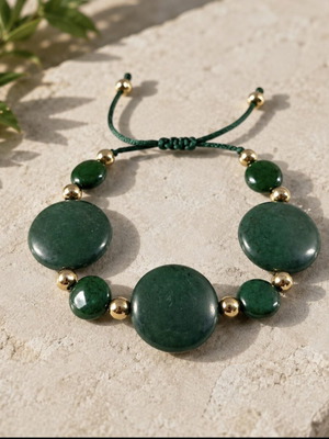 Bracelet with green stones and gold details, adjustable cord