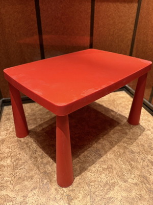 Children's red plastic table used, ideal for play and crafts