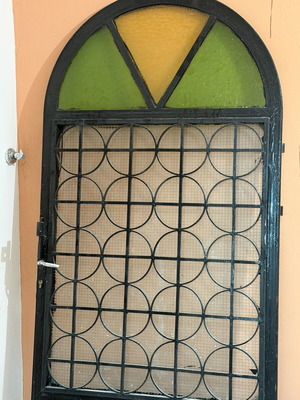 Solid iron door with panel, opening